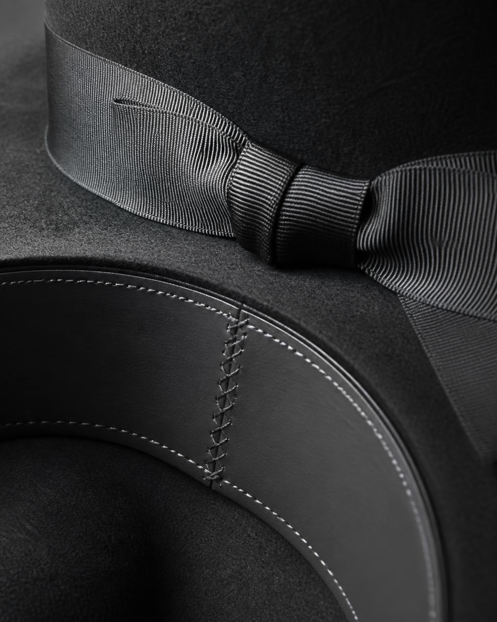 Grosgrain ribbon bow and hand-stitched leather sweatband